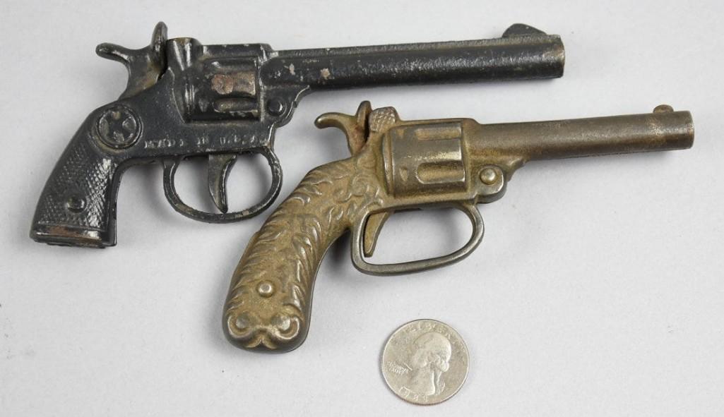 Antique Cast Iron Cap Gun, Revolvers, Kilgore, Stevens: These great toy guns are cast iron and are in revolver style. Both are cap guns, one is Kilgore with the K in a circle, made in the USA, also marked OKE and is approx 6" long. The ot