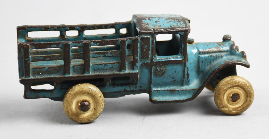 1929 Arcade Cast Iron Stake Truck, No. 213: This awesome truck is from Arcade Mfg Co (founded in 1885, sold to Rockwell Mfg Co in 1946). It is a No. 213 Farm Stake Truck and appears to be all original with the blue paint and white rubber tires.