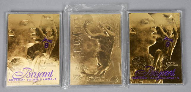 Lot of 3 23KT Gold Kobe Bryant Cards: These great cards are of the late great Laker, Kobe Bryant. Each card is embossed and marked 23KT gold. Two are Fleer from 1997 with purple lettering, one is 1997 Skybox, all gold.