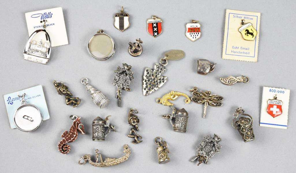 Misc Sterling/Non Sterling Charm Lot Vintage: Here is a great misc lot of 20 charms for your bracelet. There are five 800 silver and enamel charms with shields and two steins, two cuckoo clocks, a gondola and one flower basket, also all 800 silve