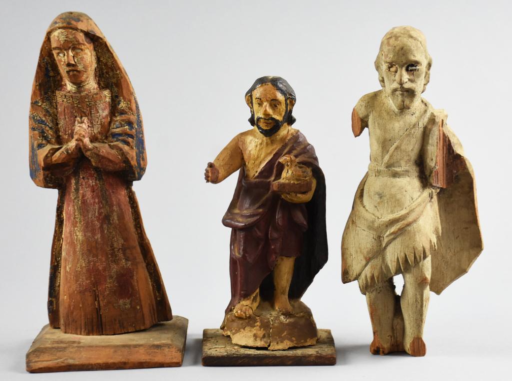 Antique Carved Santos Spanish Colonial: These are Santos religious figurines, The appear to be antique and are Mary, Jesus and unsure of the last fellow who has a wire attached for hanging. Tallest is 9.5".