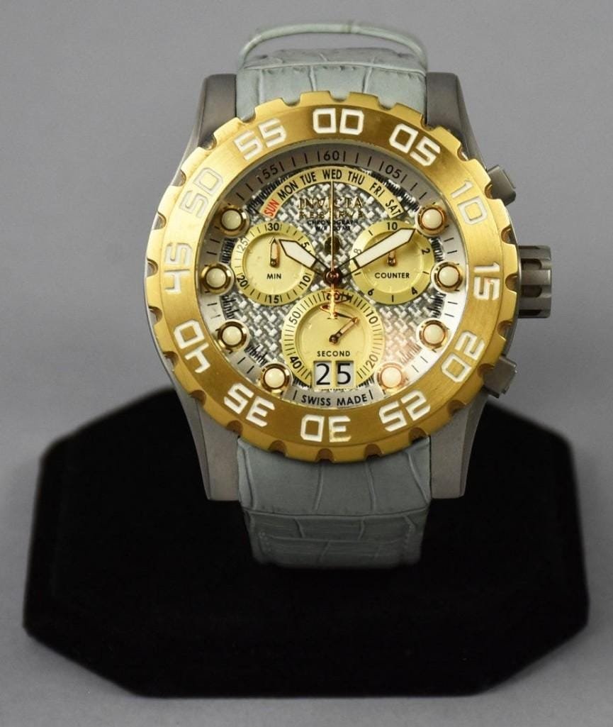 Invicta Reserve 12484: Beautiful Invicta Reserve, no. 12484 with light gray leather band with brushed silver and gold stainless details. Appears unworn.