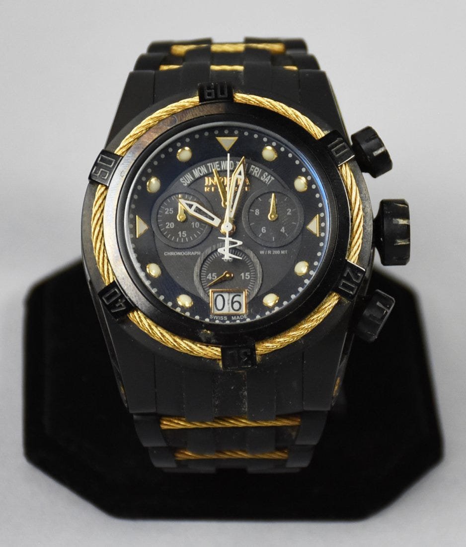 Invicta Bolt Zeus 12299: Nice looking Invicta Bolt Zeus, no. 12299. The black watch has gold accents, rubber watch band will need replaced.