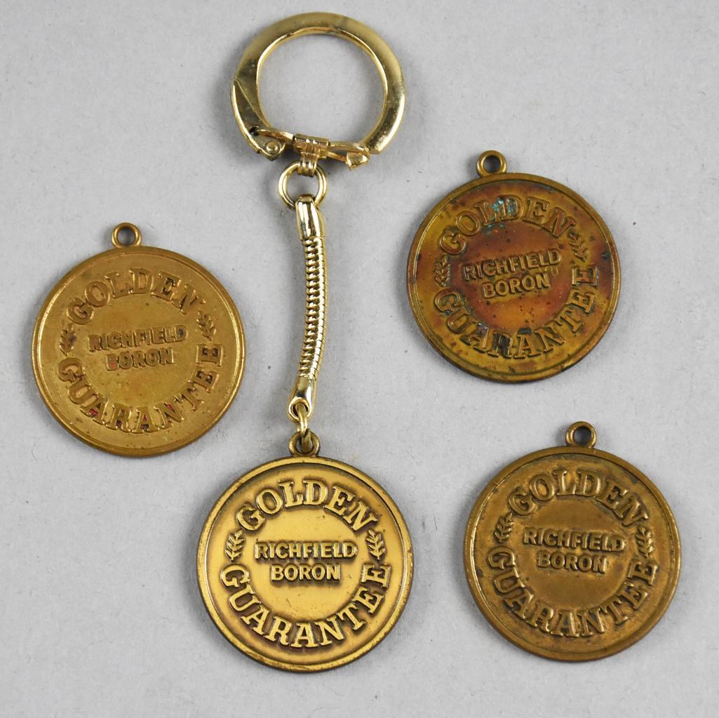 (4) Vintage Richfield Boron Keychain and Fobs: These four fobs appear to have belonged to Richfield employees. Each has a different set of initials on the back with a postal guarantee. One keychain and three loose fobs.