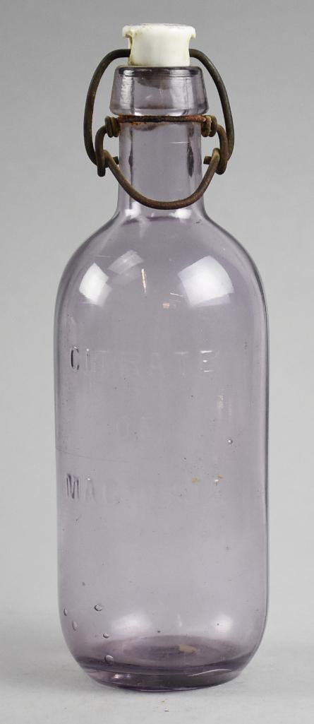Vintage Citrate of Magnesia Apothecary Flippy Bottle: This nice clear glass bottle once contained the liquid medication Citrate of Magnesia. All original and stands approx 8.25".