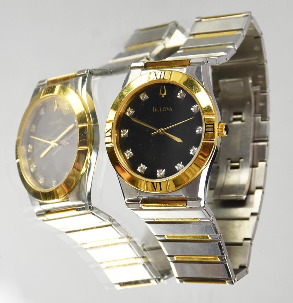 Men's Bulova 2 Tone Diamond Quartz Watch: Great looking men's 2 tone & diamond quartz watch from Bulova. This beauty is stainless steel and gold tone metal with a black face with 23 diamond indices on the face and roman numerals on the bezel