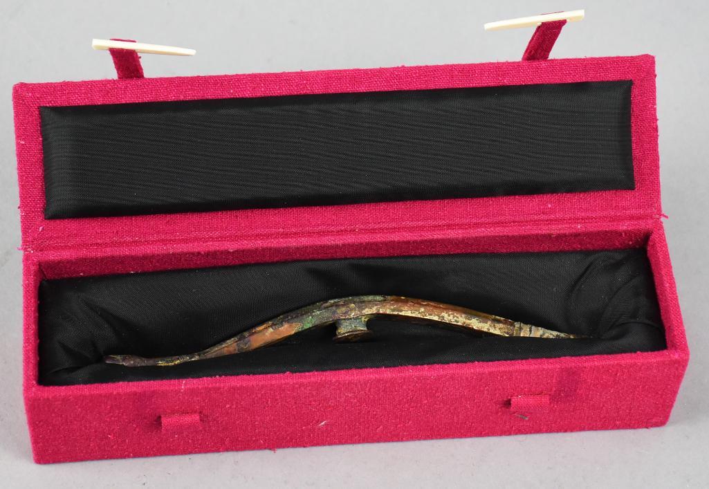 Ordos Chinese Bronze Buckle, Ibex Head: Archaic bronze buckle with ibex head with unusual sinuous form. Retains some of the original gilt, believed to be Ordos Chinese. Measures 6" long and comes in a nice presentation box.