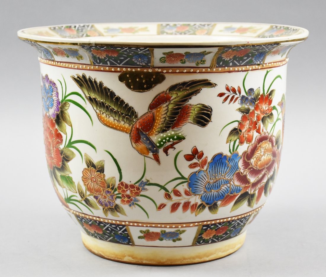 c1970 Zhongguo Zhi Zao Satsuma Porcelain Planter: This is a beautiful planter, hand painted with flowers and birds in rich blues and oranges. It is marked on the bottom with Zhongguo Zhi Zao - China made. It is a contemporary piece in Satsuma style a