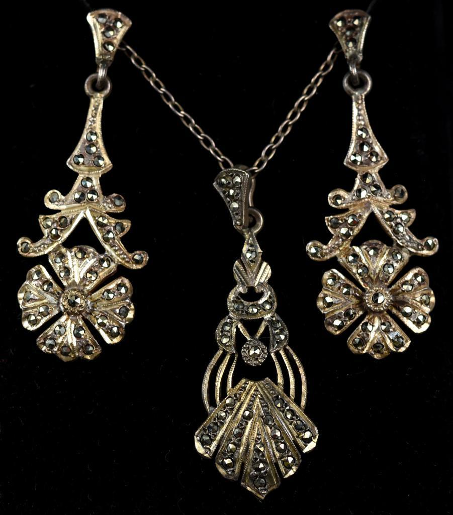 Vintage 950 Sterling & Marcasite Set: Beautiful .950 silver (better than sterling) necklace is encrusted with marcasite stones. Attached to the silver chain are a pair of flower pendants flanking a single dangle pendant in a stylized shel