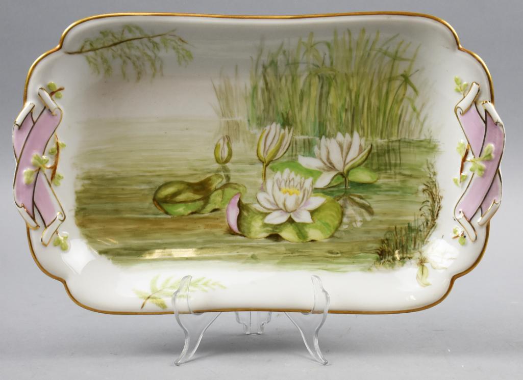 Antique Haviland & Co Depose Limoges Platter: This is a beautiful platter from Haviland & Co. Porcelain is hand painted with lily pads and reeds with pink ribbons on the handles. The edges are nicely gold gilt with gold accents on the ribbons