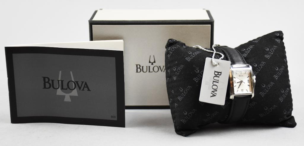 Bulova Ladies Watch, Leather Band, NIB: This watch appears to have never been worn. It is a Bulova, model C869891. Stainless back, black leather band with Japan movement. Comes with the original packaging and booklets.