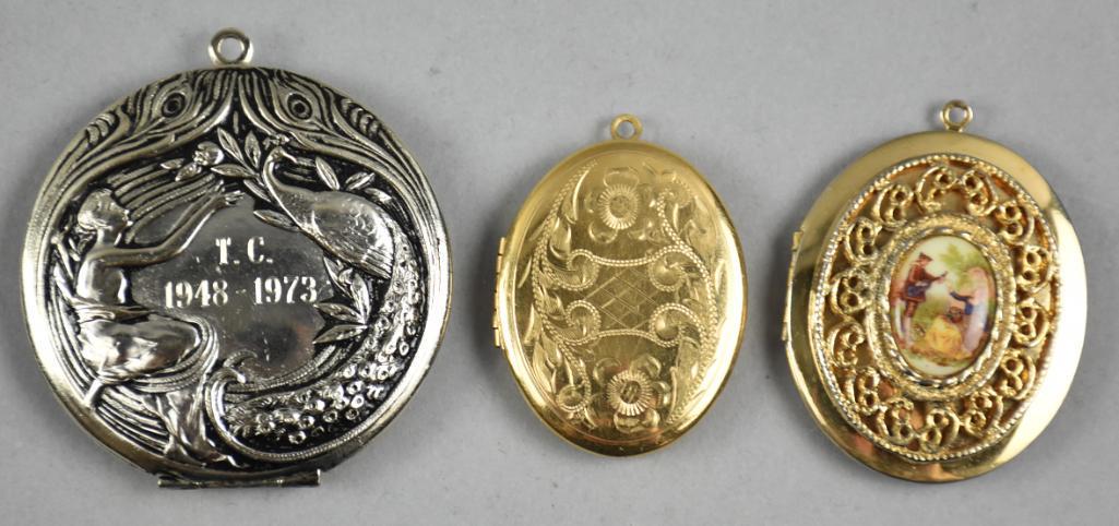 (3) Vintage Style Locket Pendants: Nice little lot of vintage style lockets, two with gold tone, one with silver. The silver is true vintage in an Art Nouveau style and is monogrammed and dated TC 1948-1973.