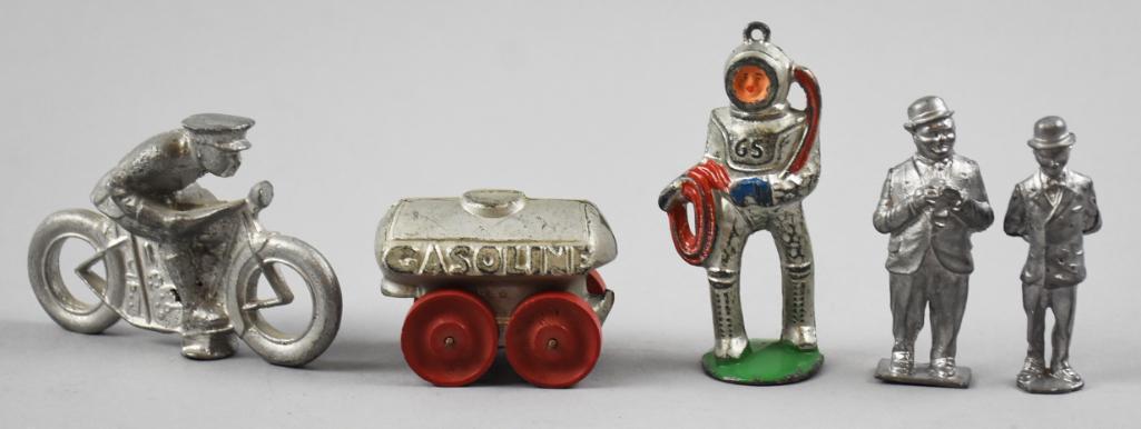 c1930 Barclay/Manoil Toy Lot, Motorcycle, Tanker: Fun variety of Barclay and Manoil toys and figurines. Includes a motorcycle, a small gasoline tanker, Manoil deep sea diver and a pair of figurines, unknown maker, cast of Laurel and Hardy.