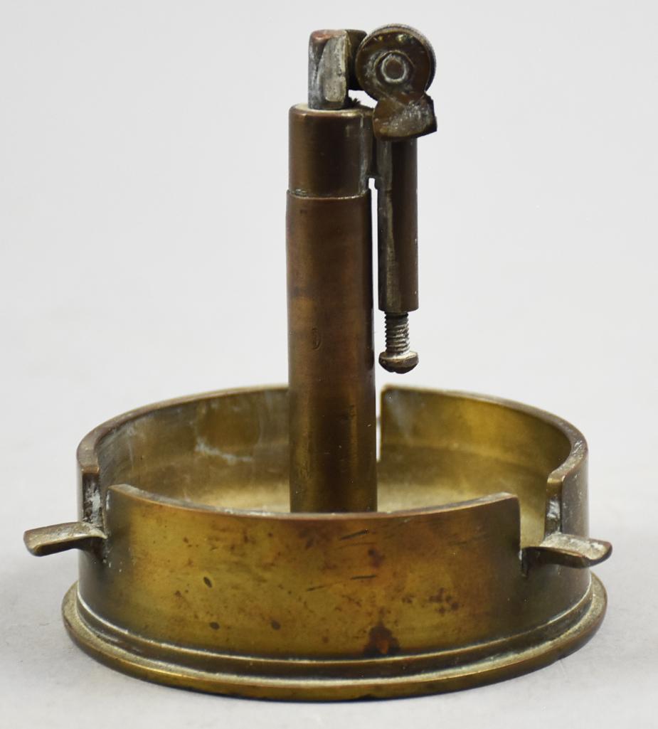 Antique Trench Art Lighter/Ashtray Combo: This cool piece of trench art is an Army 75 wz 97 shell made into a combination lighter and ashtray. No identifying mark as to who created this piece, but possibly French. Approx. 4" tall