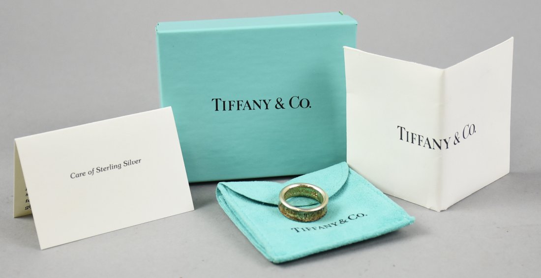 1997 Tiffany & Co Sterling Concave Band: This ring is a beautiful recreation by Tiffany & Co or their original 1837 design. Comes with all of the original paperwork and Tiffany presentation box. Size = 7
