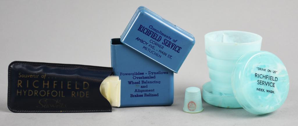 Vintage Richfield General Collectible Household: Lot is a rain bonnet from Sea World, thimble, collapsible cup, and a possible cigarette box. All are Richfield products.