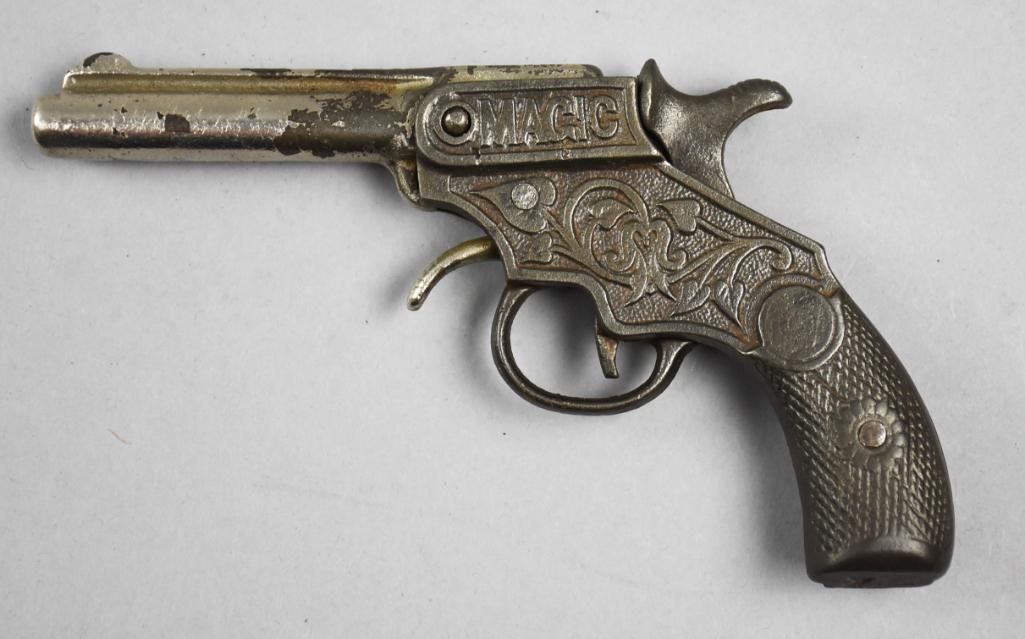 c1900 Kenton Magic Cast Iron Cap Gun: This great toy cap gun is c1900 by Kenton Hardware Co. This style is called Magic, appearing on one side and the patent date of Oct 17, 99 on the other. There is ornate leaves and textured lifelike ba