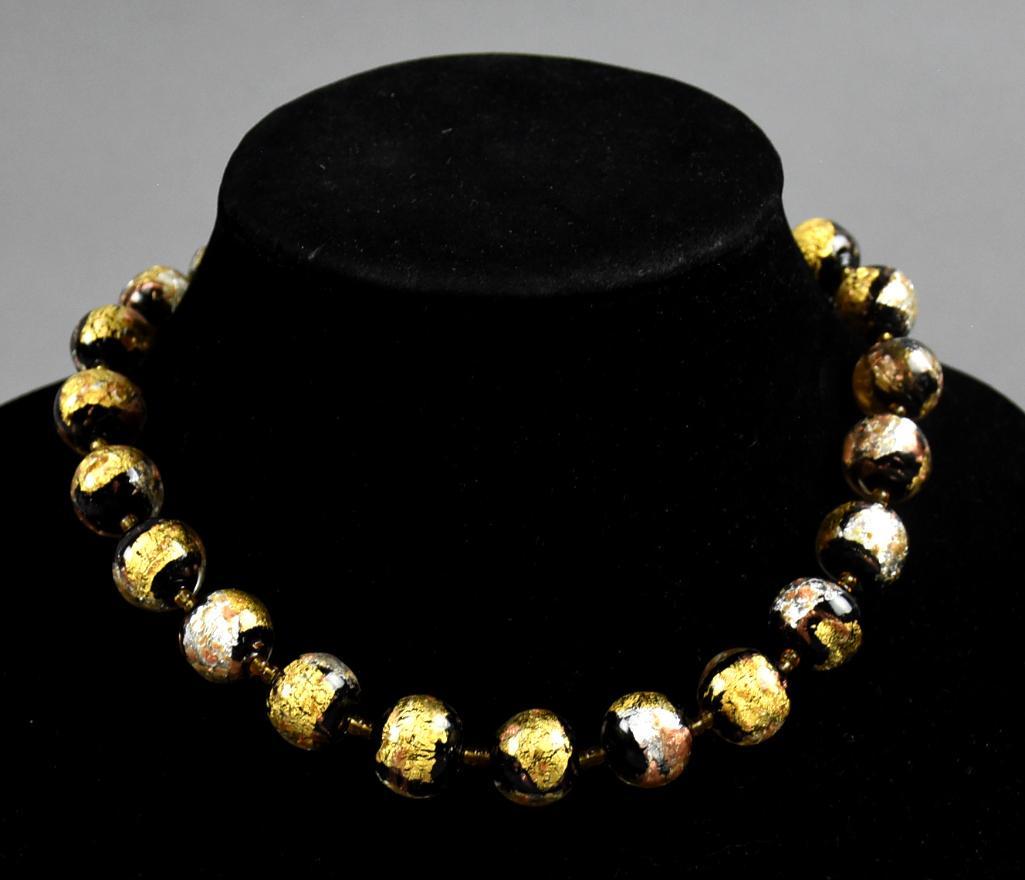 Venetian Art Glass & Murano Necklace: Wonderful vintage choker length necklace with Venetian art glass beads. Each bead is gold and silver foil and appear to be roughly all the same size and two seed bead spacers between each one. No visi