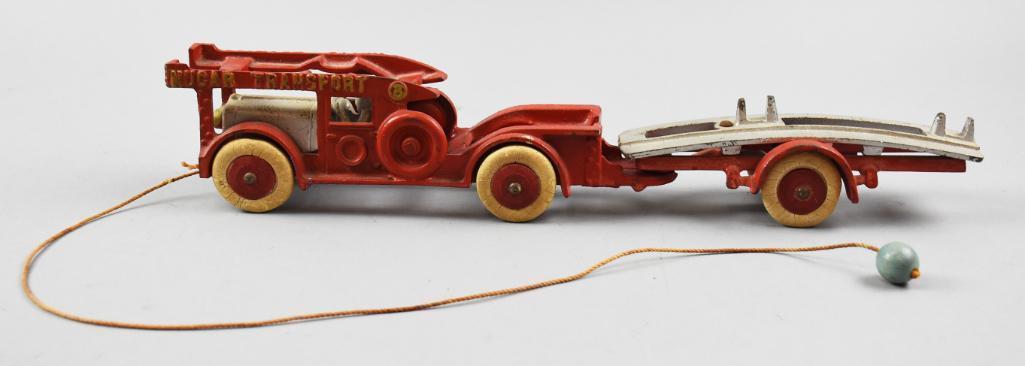 c1930 Original Cast Iron Nucar Transport: This fun toy is a Hubley cast iron Nucar Transport. It appears all original with paint, tires and pull string with ball. There are three different numbers impressed on the parts, 1930, 1931 and 1932. 