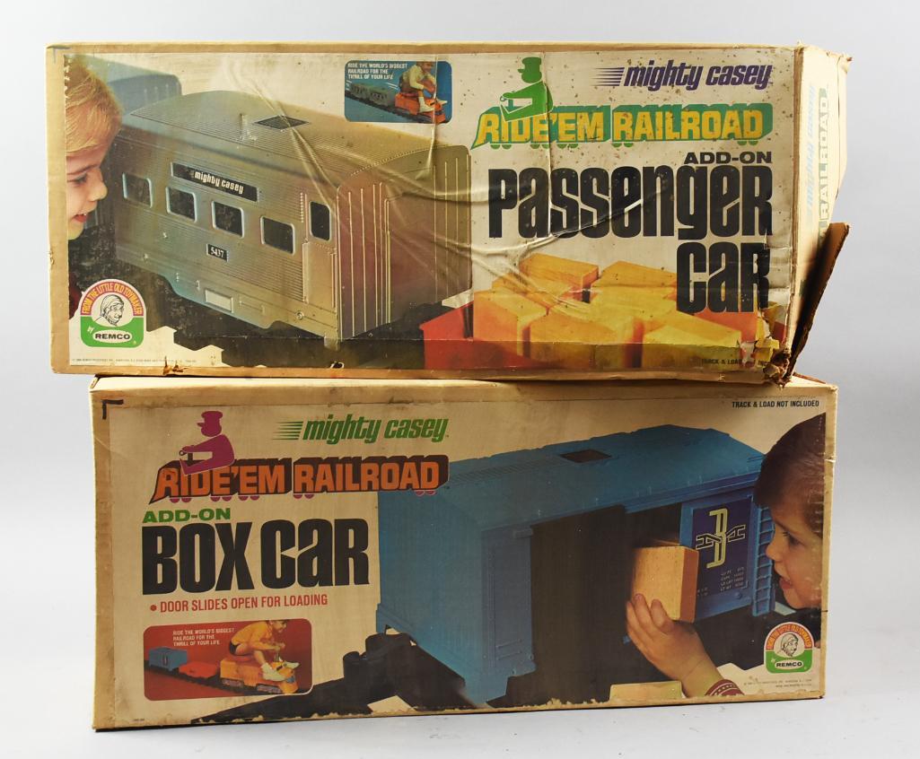 Pair Vintage Mighty Casey Ride 'Em Railroad Cars: These two pieces are Remco's Mighty Casey Ride 'Em Railroad add on cars from the 1960s. Both come in original boxes,and are a box car and passenger car. One was unopened so I choose not to ope
