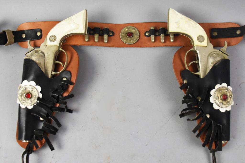 Vtg Hubley Marshall Cap Guns, Jeweled Dbl Holster Belt: For your little sheriff in training is this cute set of Hubley Marshall cap guns with leather gun belt, complete with little hollow plastic bullets. The holsters and belt are adorned with faux jewels.