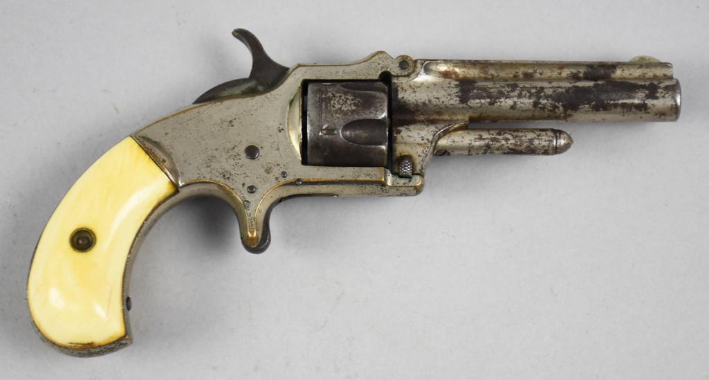 c1875 Marlin XXX Standard 1872 .30 Caliber Revolver: This great looking J.M. Marlin XXX Standard 1872. This .30 caliber revolver with tip up barrel and spur trigger. Nickel finish with natural materials grips. There were a few variations of the XXX Stan