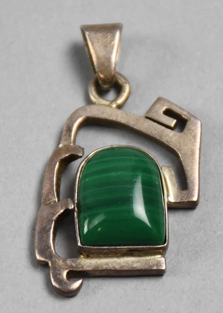 Mexican Sterling Pendant Erika Hult de Corrall: Mexican sterling silver pendant set with a malachite stone. These were made by Erika Hult de Corrall (founded 1965). Marked on the back TR-26 Ric Tax Mex 925.