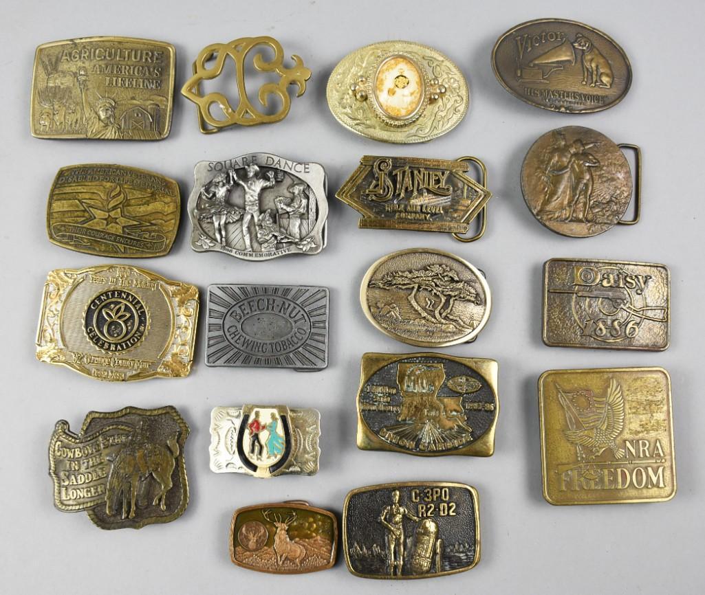 Lot of 18 Belt Buckles, Variety of Themes: Big lot of mainly brass belt buckles, mostly advertising themed from Daisy, NRA, RCA Victor and more. Included will be one Native American style in nickel silver