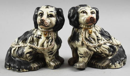 Staffordshire Black & White Spaniels: These stunning and unusually painted spaniels are from the 19th century. Staffordshre of origin painted with black features. Both with molded collars with bells around neck and chain, accented in gold