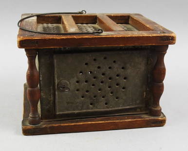 Primitive Antique Carriage Foot Warmer: Beautiful primitive antique foot warmer. Would have been for a carriage or general house use. Hand crafted cut wood frame around a pierced tin box with door with twist lock and carrying handle. Measur