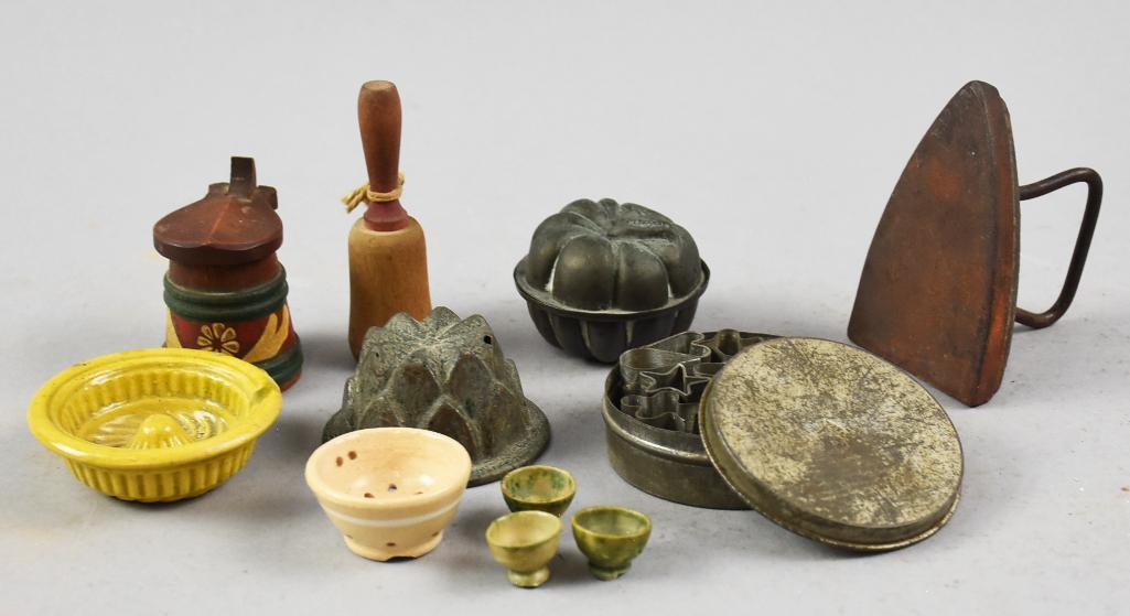 Vintage/Antique Child's Kitchen Gadgets: Fun lot of vintage and antique children's kitchen gadgets from juicers, to jelly molds and cookie cutters, egg cups, juicer and strainer and more. All measure from 5" to 3.5" tall