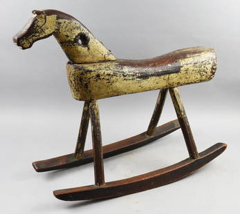 Primitive Folk Art Carved Rocking Horse: This is a very cool looking rocking horse. Primitive folk art, hole in neck for reins. Distressed paint. Purchased from John Gordon (d. 2003) Gallery Americana. Measures approx 23" tall x 26" wide