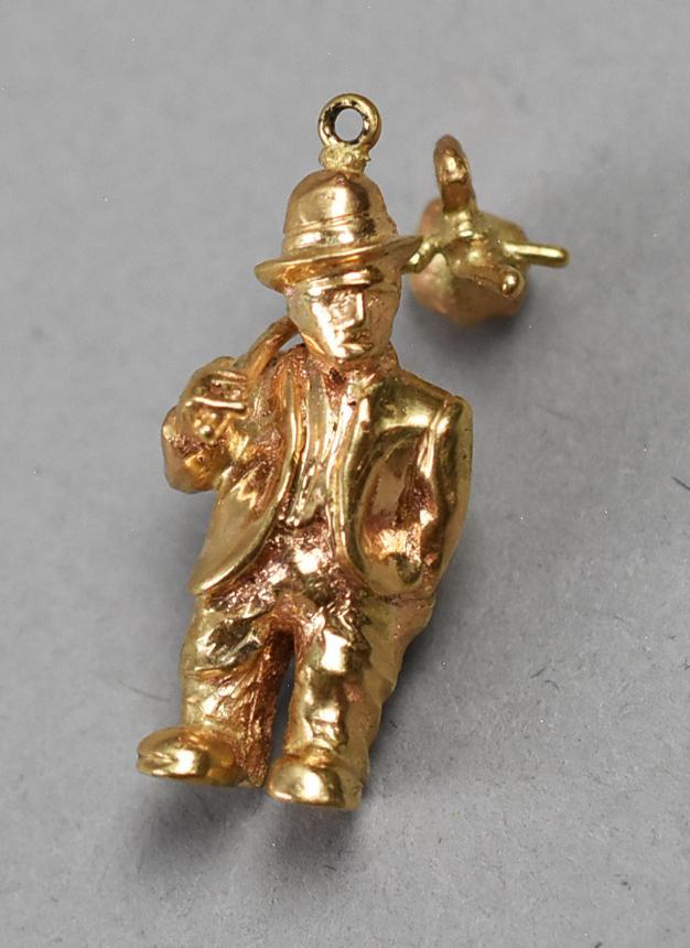 14k Yellow Gold Vagabond/Hobo Charm: Sweet little charm in the form of a hobo or vagabond.One boot heel stamped 14K. He is approx 1 1/4 tall, weighs approx 11.8g.