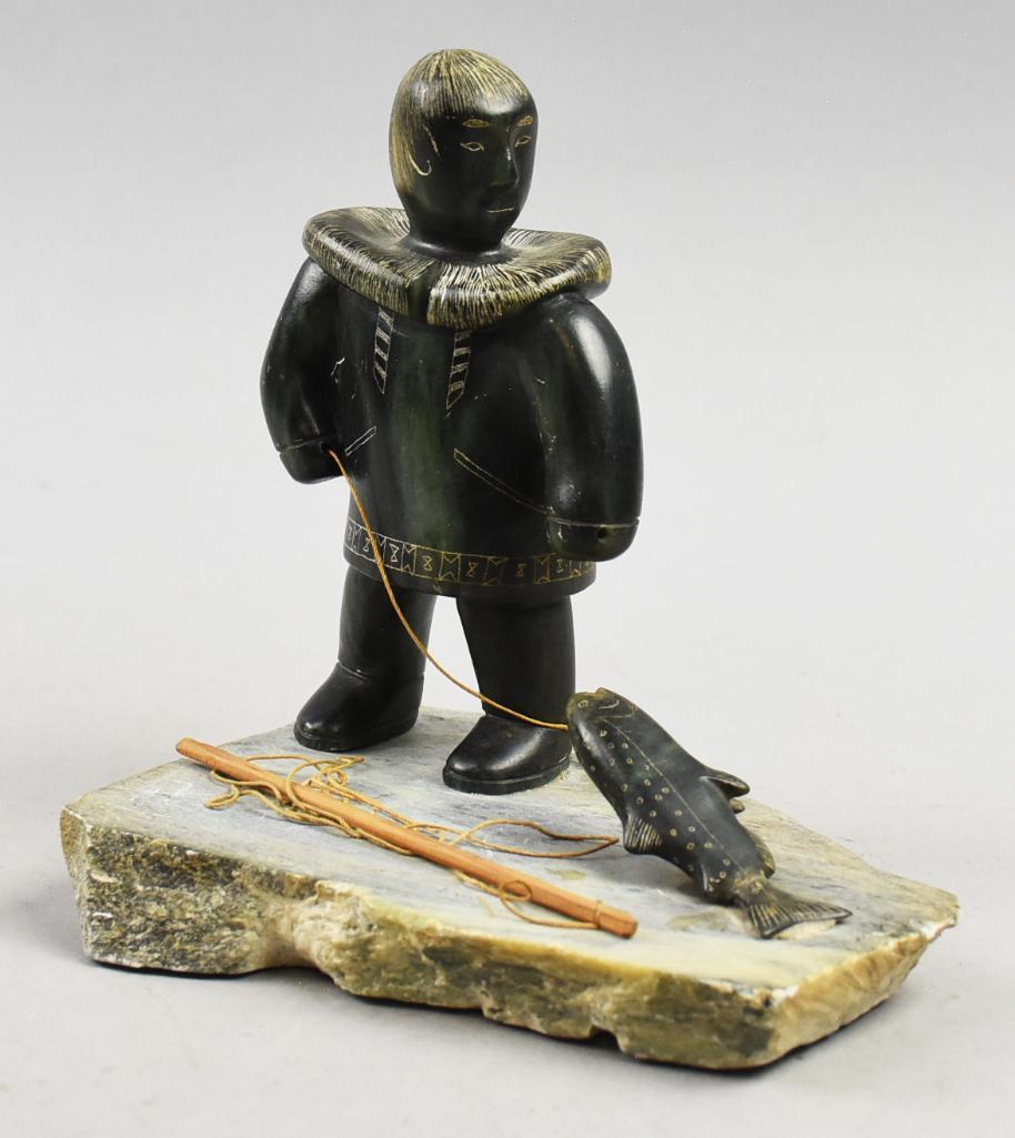 Inuit Artist Glen Tingook (1938-2000) Stone Fisherman: This cool piece is from Inuit artist Glen Tingook (1938-2000). This fisherman is nicely carved stone with great detail in the face and hair. Carved fur colar and lines in his coat. Fish is detai