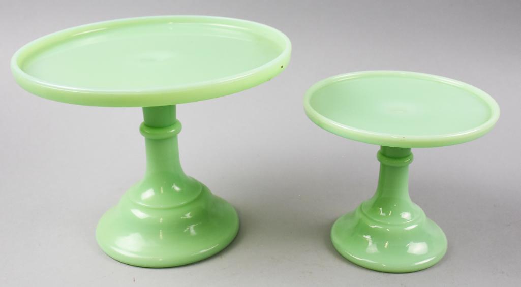 Pair Mosser Jadeite Pedestal Cake Stands: Both of these pretty cake stands are attributed to Mosser Glass Company. Molded jadeite glass and measure 5.5" tall x 6.5" across and 7" tall x 9.5" across