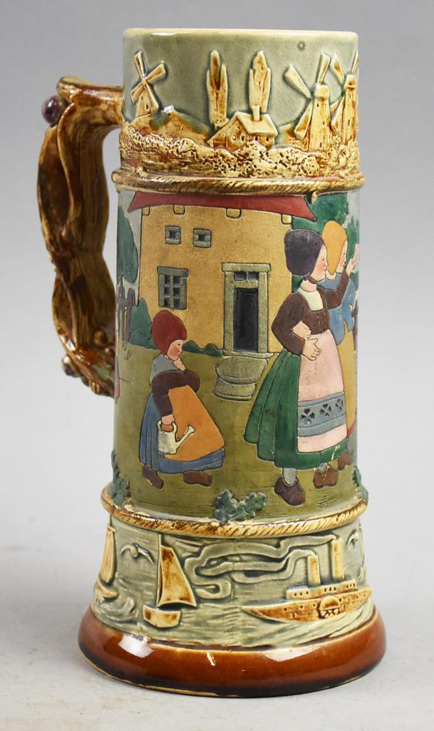 c1930 Scarce J.W. Remy German, Dutch Children Stein: Very few of these come up on the market. This is a great looking German stein from J.W. Remy. The theme is Dutch children with windmills and sailboats. Marked on bottom with impressed 11072 Germany an