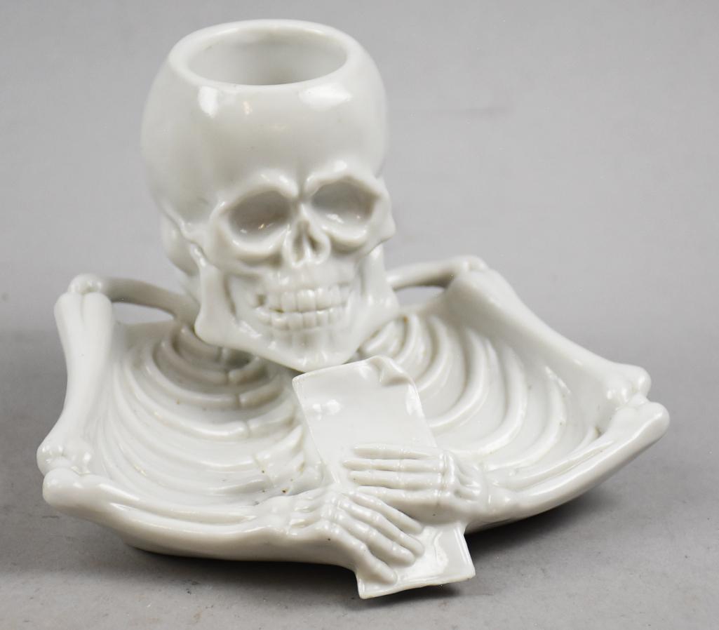 Antique Germany Porcelain Skull Ashtray, Trinket Dish: This is a very cool piece that appears to have been an ashtray with match holder. This skull is open at the top with skeleton body as the ashtray. I would be a very cool trinket dish for those who lov