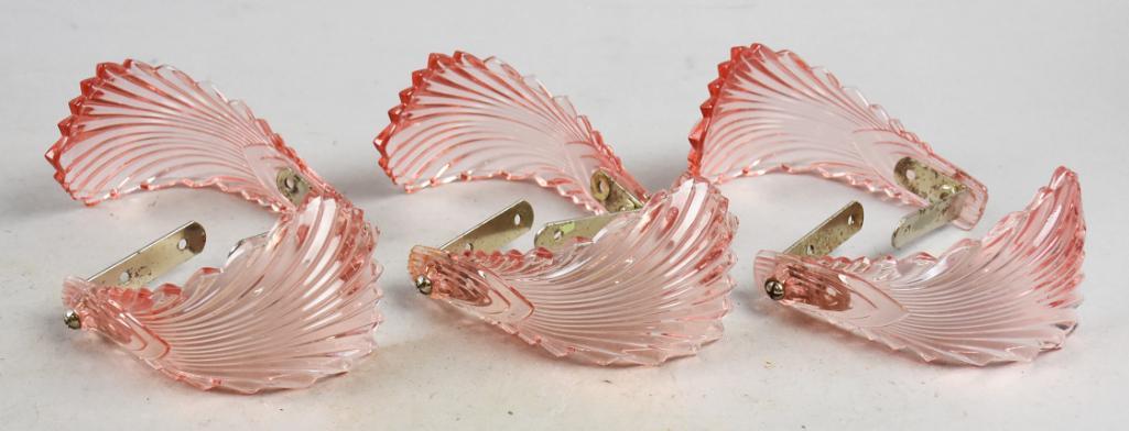 Art Deco Style Pink Glass Curtain Tie Backs/Brackets: These are very pretty and in the Art Deco style. Pink glass with what appears to be steel, curtain tie backs or curtain brackets. Each measures approx 3" tall x 4" wide