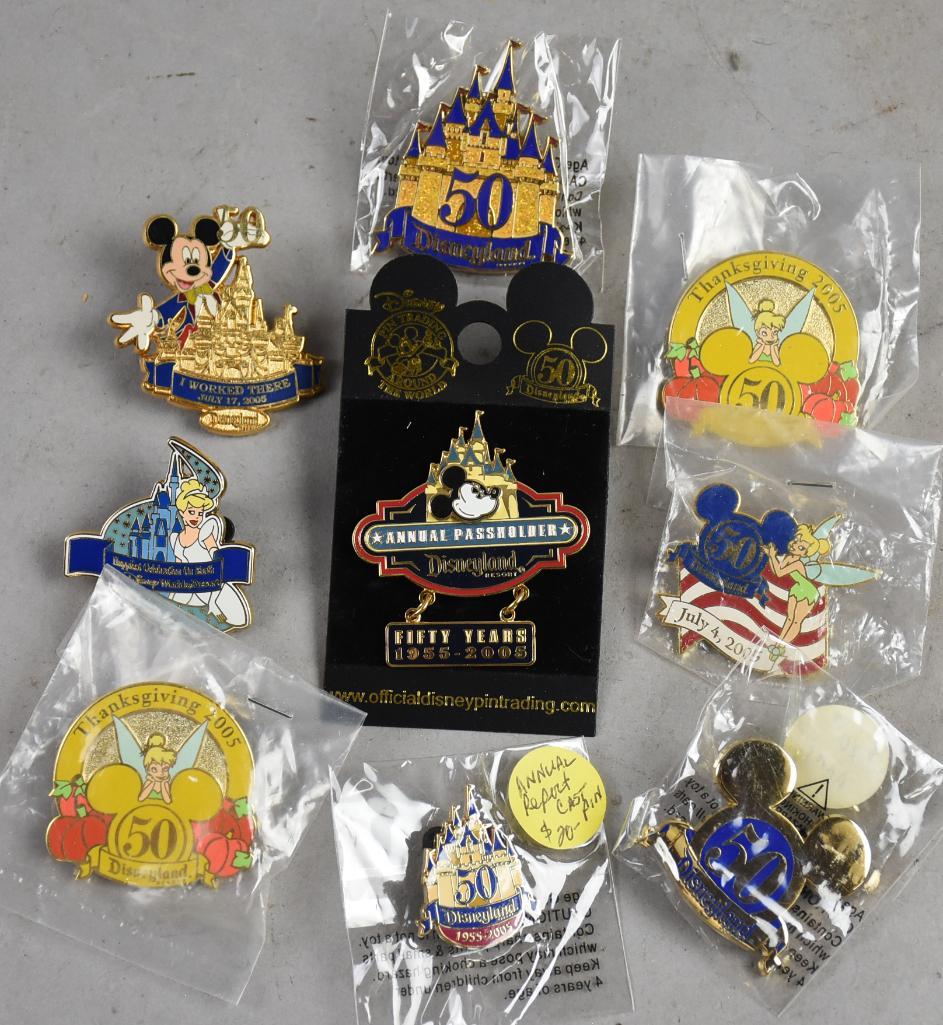 Disneyland 50th Anniversary Trade Pins: Nice lot and variety of Disneyland trading pins that commemorate the 50th anniversary of the theme parks. Most retain original packaging.