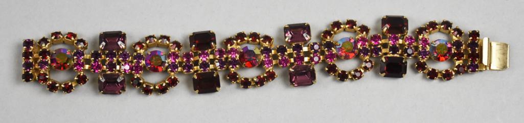 Vintage Kramer of New York Crystal Bracelet MCM: Fabulous vintage Kramer of New York bracelet. Beautiful crystals in red and AB red and amethyst in color. Marked on push locking clasp