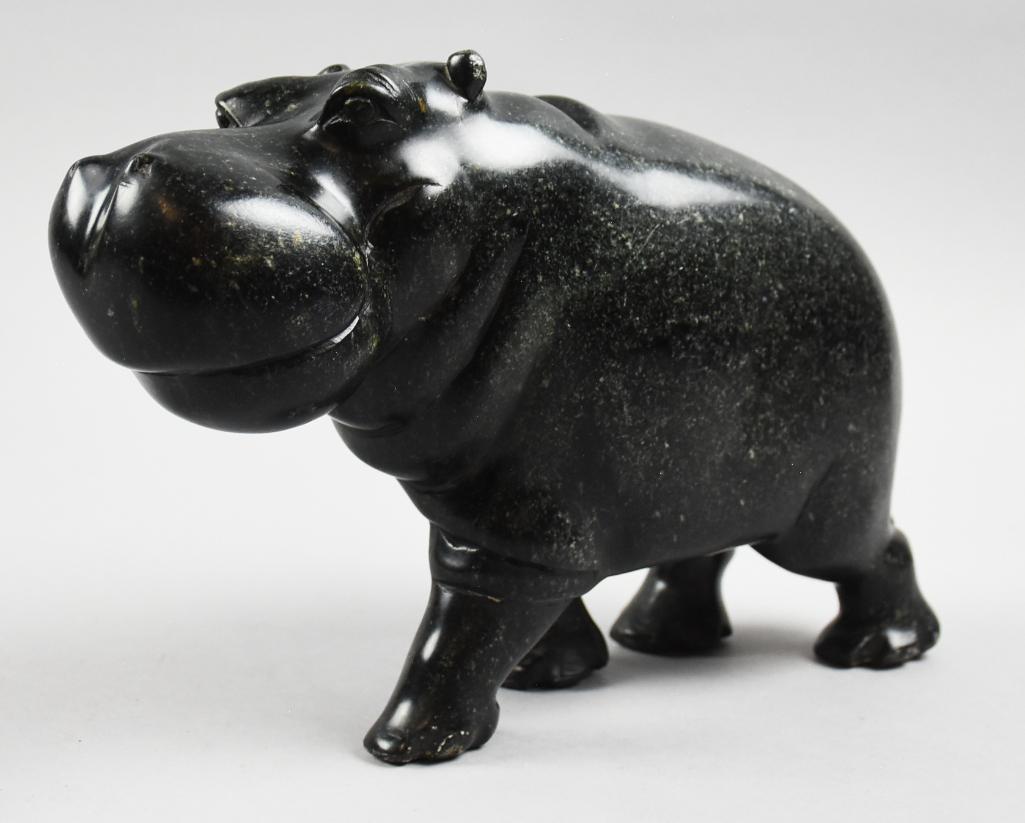 Carved Soapstone Carved Hippo Figurine: This is a sweet hippo figurine, carved soapstone. Looks like he's smiling. Measures approx 7.5 tall x 13 long, no visible marks
