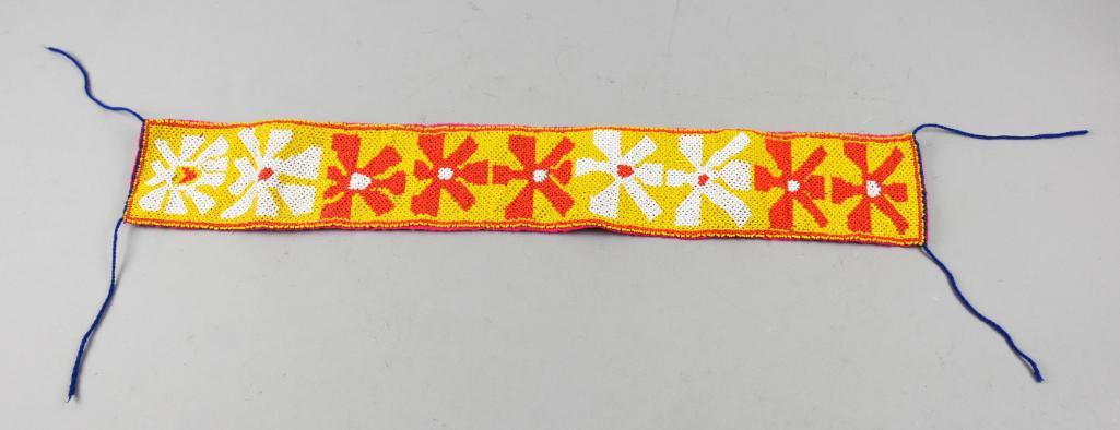 Vintage Native American Hand Beaded Choker: This pretty choker is hand crafted and Native American. Orange, yellow and white beads make up the flowers, hand sewn pink cloth back. Measures approx 4" x 26"