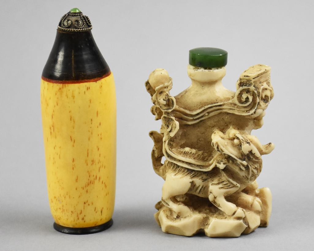 Chinese Scrimshaw and Resin Snuff Bottles: Nice looking pair of snuff bottles with one appearing resin with dragon form and other other appears bone with cap having what appears to be a jade stone. Measure from 3.5" tall and 2.75" tall