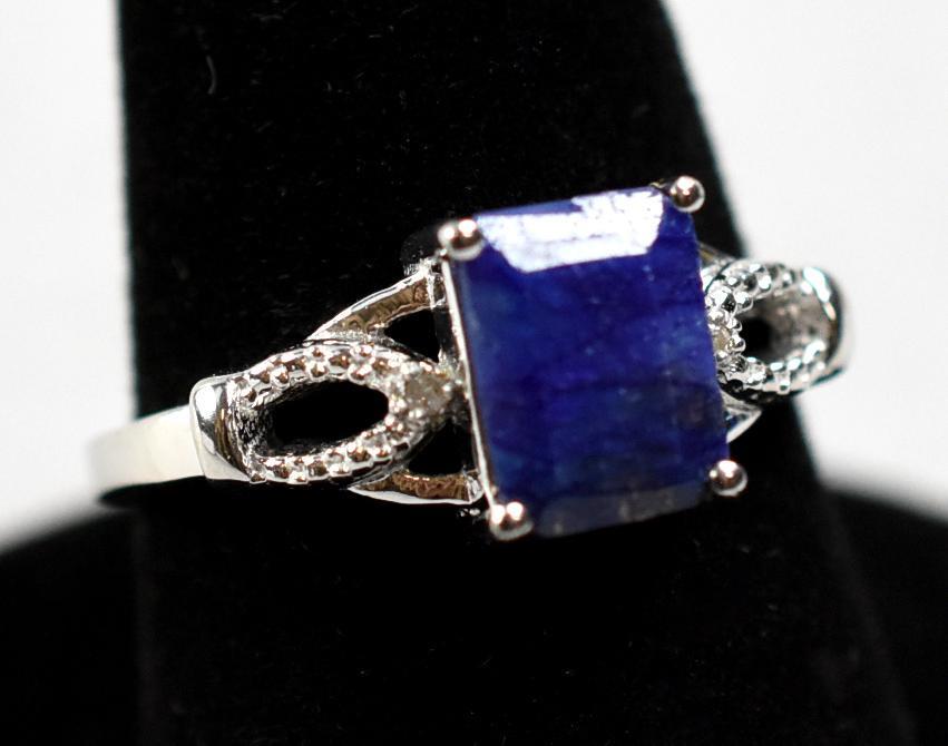 Blue Emerald & Diamond Sterling Ring: Emerald cut blue emerald (Beryl) & Diamond Ring. A blue emerald is called Maxixe (part of the Beryl family, same as emeralds), from the mine in Brazil where it comes from. Ring size = 7