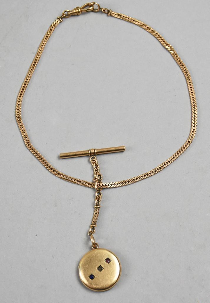 Antique Gold Plate Locket w/ Gems & G.F. Watch Chain: Pretty locket is antique and appears gold plate with three prong set gemstones on front. Comes with a gold filled watch chain from Simmons.