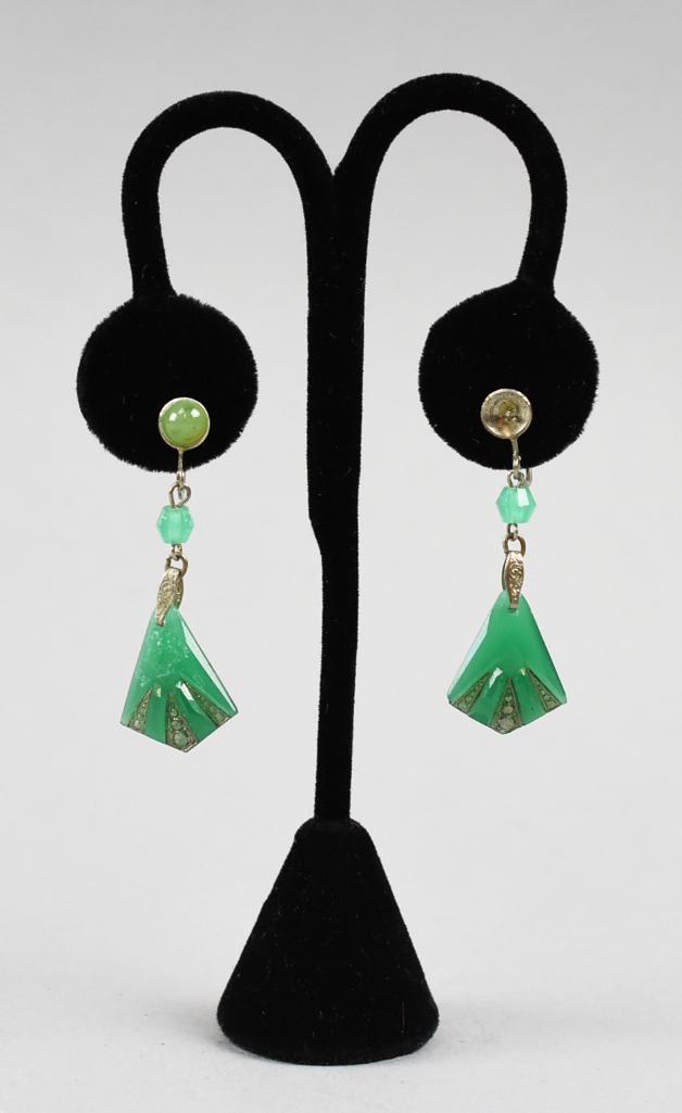Vintage Art Deco Green Glass Fan Screwback Earrings: These are a beautiful pair of screwback earrings. This Art Deco pair are green glass in a fan shape with carved geometric shapes that have a silver accent. Unmarked and unknown maker.