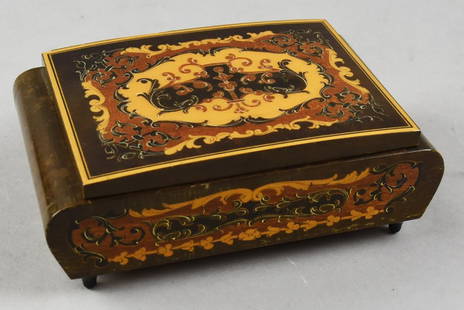 Vintage Reuge Musical Cigarette Holder, Italian Made: Lovely marquetry cigarette holder/dispenser was Made in Italy.  Reuge music box plays Dr. Zhivago Lara's Theme.  Inlay is multi color wood with C and S scroll motif.  Measures 2.5" tall x 5" x 7.5"