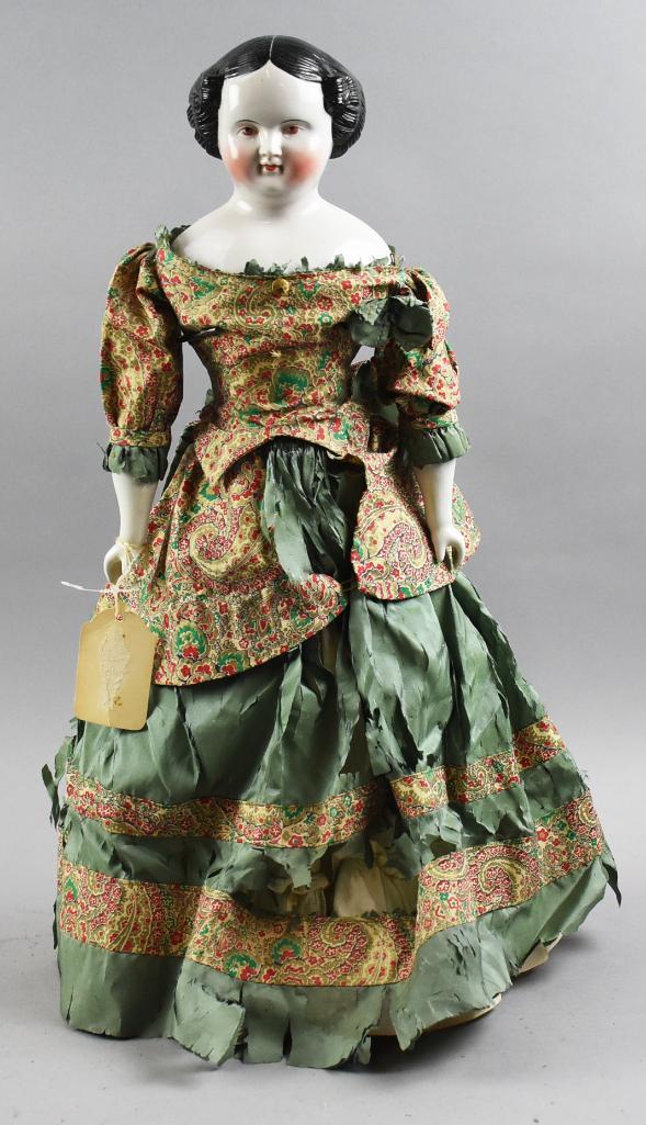 c1850 Covered Wagon China Head Victorian Doll, Brown Eyes, 22" T: Here is a wonderful c1850 china head doll with covered wagon hair. The unique feature that you rarely see are the "comb marks" in her hair. She has hand painted features and brown eyes. Dress may be o