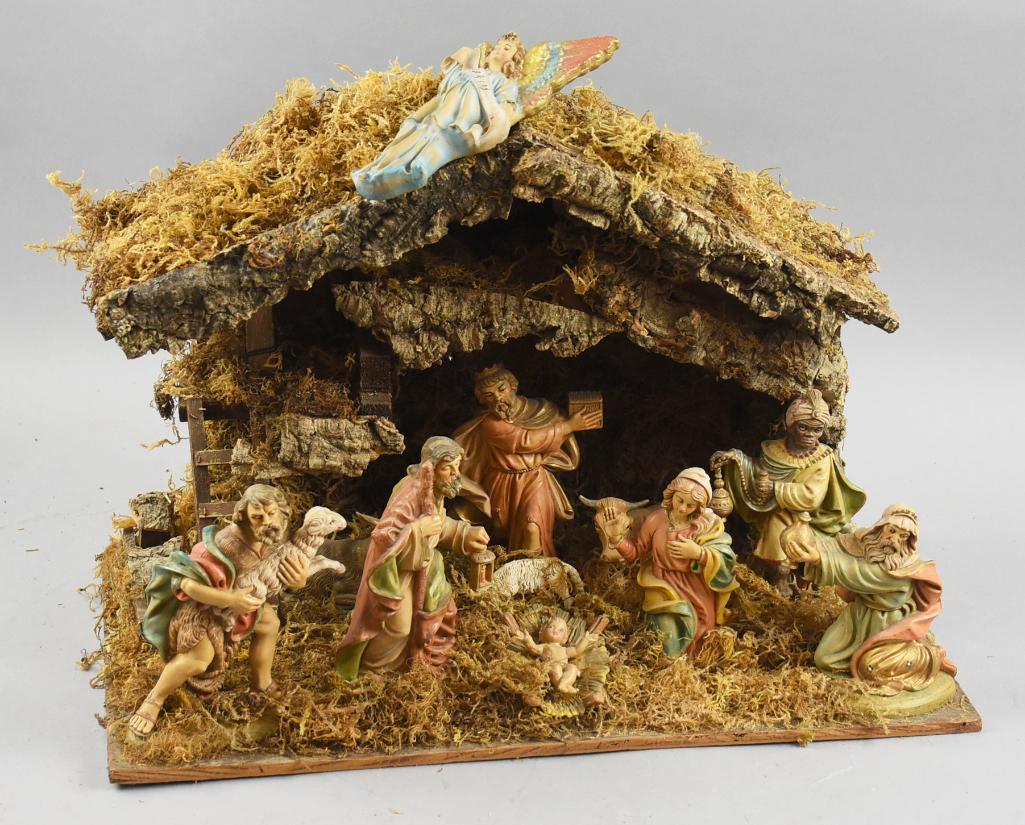 Vintage Italian Musical Nativity Scene w/ Manger: Wonderful vintage nativity scene with moss covered manger that appears complete. It is believed to be of Italian origin and plays the carol Silent Night. Measures approx 14" tall x 10" x 20".