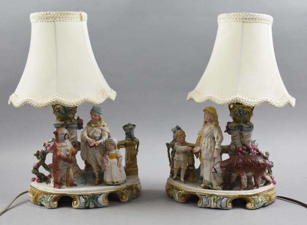 19th C Heubach Bisque Figurines, Lamp Conversions: These beautiful lamps are comprised of a pair of bisque figurine groupings attributed to Heubach. Each is stamped on bottom German with consecutive numbers of 6897 and 6898. Figures on each are a man